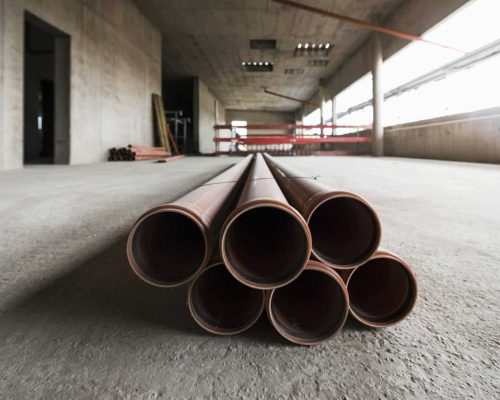 Pipes in an unfinished building under construction