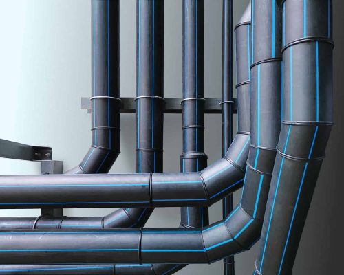 Water Utility HDPE Piping System Against Light Blue Wall