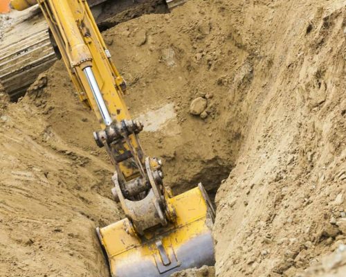 Working Excavator Tractor Digging A Trench.